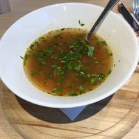 Vegetable sour soup at La plăcinte in Bucharest