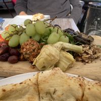 Vegan charcuterie board with grapes, artichoke, caramelized onions, olives, roasted zucchini, and walnuts   at Garage Buona Forchetta in Coronado