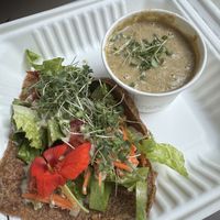 Onion ranch wrap with crumbles walnuts and veggies. Broccoli cashew soup on the side. Both amazing. These wraps are to die for!  at Mama Roots in Duluth