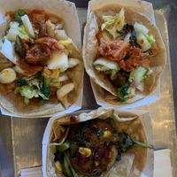 Tacos: Tofu edamame falafel, spicy Korean tofu, and roasted veggies & pomegranate   at Kimchi Grill in Brooklyn