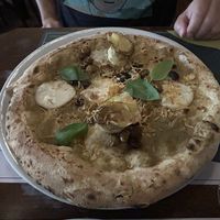 Mozzarella, artichoke, olive pizza  at Organic Pizza & Food in Milan