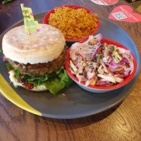 Chickpea burger, spicy rice, rainbow slaw at Nando's in Walkden