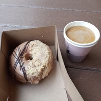 Vegan donut and Americano with oat milk at The Salty Donut in Dallas