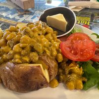 Coronation chick pea filling with baked potato and salad at 3 Peaks Cycles in Settle