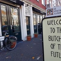 welcome to the butcher of the future - streetsign at De Vegetarische Slager - The Vegetarian Butcher in The Hague