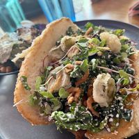 Dill dig with a kale salad side   at Good Dogs Plant Foods in Vancouver