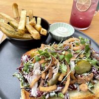 Dill hot dog with fries  at Good Dogs Plant Foods in Vancouver