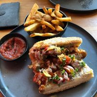 Hail Seitan dog with half side of Fries at Good Dogs Plant Foods in Vancouver