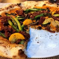 Vegan pizza - fresh tomato sauce with garlic and fresh basil, green asparagus, zucchini, brown mushrooms, sun dried tomatoes  at Pizzamania in Bucharest