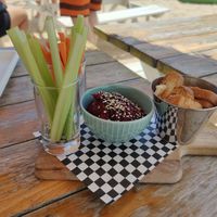 Hummus with breadsticks and veggies at Areal Beach Bar by Chakall in Lourinha