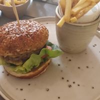 PLANT BURGER: Beetroot & mushroom burger served in a pretzel bun w/ gem lettuce/tomato/red onion/fries at Coal & Cotton in Worsley