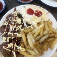Vegan beef with salad (under the sauce!) and chips   at Karma Tea House in Wollongong