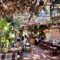 Interior of bar- smoking sections as not fully covered   at Komiteti in Tirana