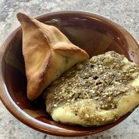 Mini spinach pie (left) and mini thyme za’atar pie (right) at CedarLand in Dayton