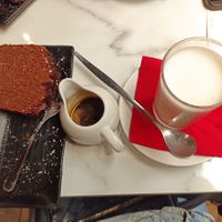 Plum cake and coffee with oat milk at Emporio Sant'Eustachio in Rome