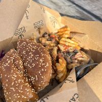 Fried Cauli Chik'n Sandwich with Waffle Fries topped with Chili & Cheese 🤤 Goot Lawt  at Community Vegan in Austin