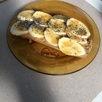 Toast with home made peanut butter and bananas  at Biomio Brunch Ecológico in Sevilla