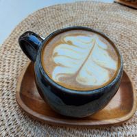 Latte with oat Milk : yummy (i asked for extra sugar) at Biomio Brunch Ecológico in Sevilla