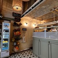 Inside: the fridge has Kombuchas etc. Organic veggies for sale.  at Biomio Brunch Ecológico in Sevilla