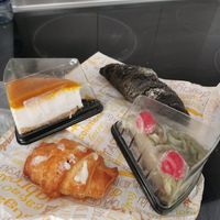 Mango-Cheesecake, Pistachio cake, coconut croissant (Filmes), black croissant with orange flavor at Tentacions in Figueres