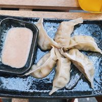 Gyoza with tofu and veggies with a sesame seed sauce at Reispapier in Cologne