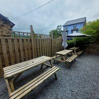 Tŷ Coets Outdoor Seating (ft. a sneaky dog) at The Real Coffee Stop in Beddgelert
