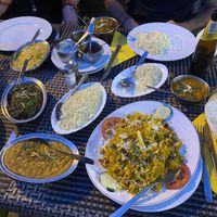 Korma (NOT vegan), veggie curry (vegan), saag aloo (vegan), tarka daal (vegan), chickpea biryani (vegan), rices and chapati (vegan)  at Maharaj in Mallorca