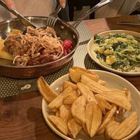 Pan fried polenta with vegetables, veggie patty and fried onions, aswell das potatoes and Swiss chard   at Ružmarin in Opatija
