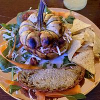 Baked pumpkin with tasty filling, tortilla chips with salsa and bread.   at Caféteket in Slagelse
