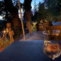 Dinner on the patio with fairy lights at sunset. at Salt Spring Wild Cider in Salt Spring Island
