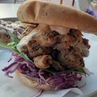 These are Oyster Mushrooms lightly breaded and fried topped with all sorts of goodies ... a Stacked Burger that came with s with a smashed potato herb garlic cake  at Christopher's Kitchen in Palm Beach Gardens