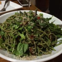Pesto soba noodles with lots of basil, arugula, sun dried tomatoes, and fresh tomatoes at Christopher's Kitchen in Palm Beach Gardens
