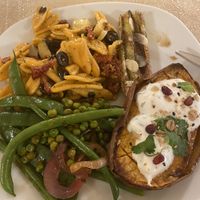 Pasta bio salad + sweet potato with vegan cheese  at La Papa in Barcelona