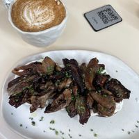 Mushroom toast & chai oat latte  at La Papa in Barcelona