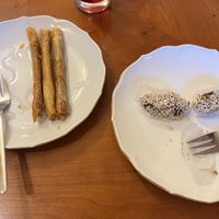 Sweet cigars and peanut filled, sesame covered dates  at Tsnim in Kamnik