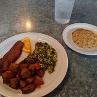 Pesto tofu scramble with vegan bacon, pancakes, and home fries at Downbeat Diner and Lounge in Honolulu