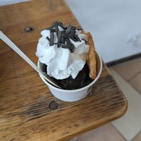 Lakritzbecher: two scoops of licorice ice cream, licorice sauce, licorice sprinkles, whip, more sprinkles. at Die Eisbande in Hamburg