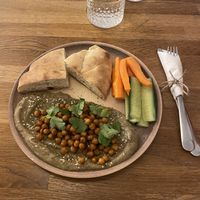Vegan baba ghanoush with pita, chickpeas, carrots and concombres.   at Café Datel in Ceske Budejovice
