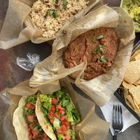 The tofu taco, jackfruit taco, a side of guacamole, a side of rice and a side of beans  at Nollie's Taco Joint in Carolina Beach