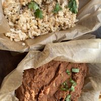 Full side of rice and a full side of beans.  at Nollie's Taco Joint in Carolina Beach