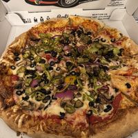Tony’s pizza with vegan cheese and jalapeños   at Caliente Pizza & Drafthouse in Aspinwall