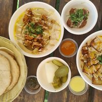 Top: crispy lemon califlower hummus, eggplant hummus at HaHummus HaNoded - החומוס הנודד in Maayan Baruch
