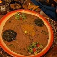 This is the spinach and lentil dish, on top of a giant sharing Eritrean pancake/bread at Wedeb's in Tromsoe