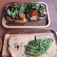 Hunmus toast with mushrooms,rucola and tomato and cashew-cheese toast with avocado at Sama Sama Veggie in Salou