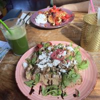 Green juice and mushroom focaccia (new menu)😋. The pancakes were topped with cherries instead of apple this time around🍒  at Little World Kitchen in Utrecht