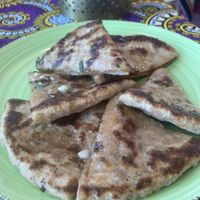 Side of cheesy naan  at Little World Kitchen in Utrecht