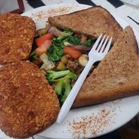 Vegan Breakfast Plate: Sauteed veggies with Beyond Burger, hash browns, and toast. at Heat Da Spot Café in Washington