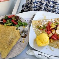 Savoury vegan crepe with mushroom, corn, vegan mayo and "cheese" (left) and sweet crepe with fruits and mango sorbet (right) at Chocolat Cafe Creperie in Naxos