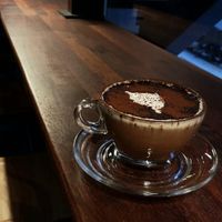 Hot chocolate and seating at bar stool area at Coffee Doga Heritage - Ehwa branch 커피도가 헤리티지 이화점 in Seoul