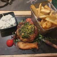 Vegan steak on mushrooms with potatoes and tzatziki at Wirtshaus im Tutzinger Hof in Starnberg